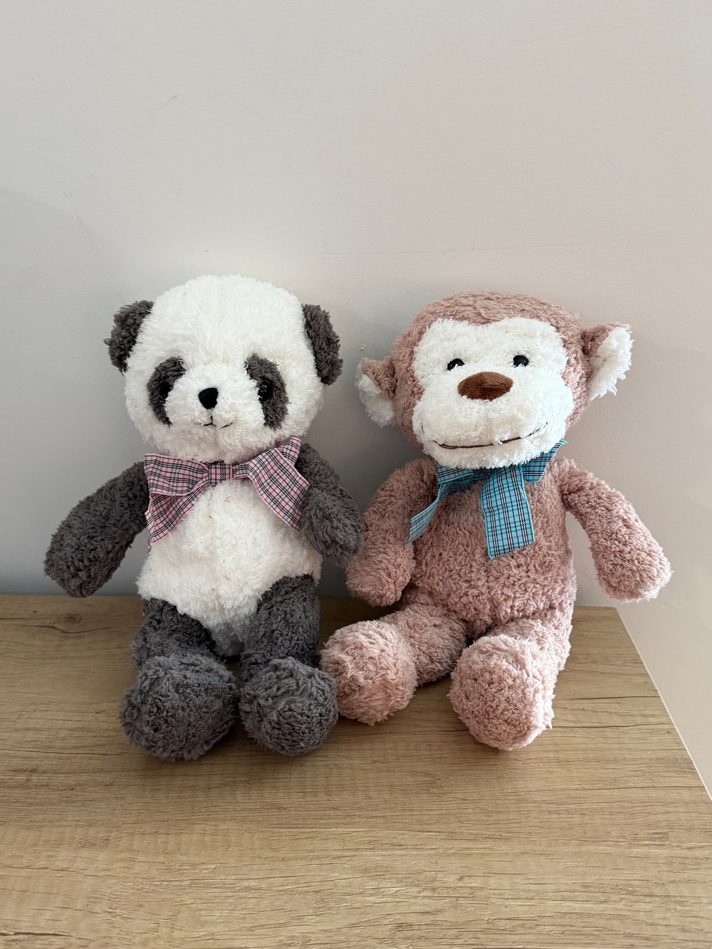 Monkey and panda plush toys
